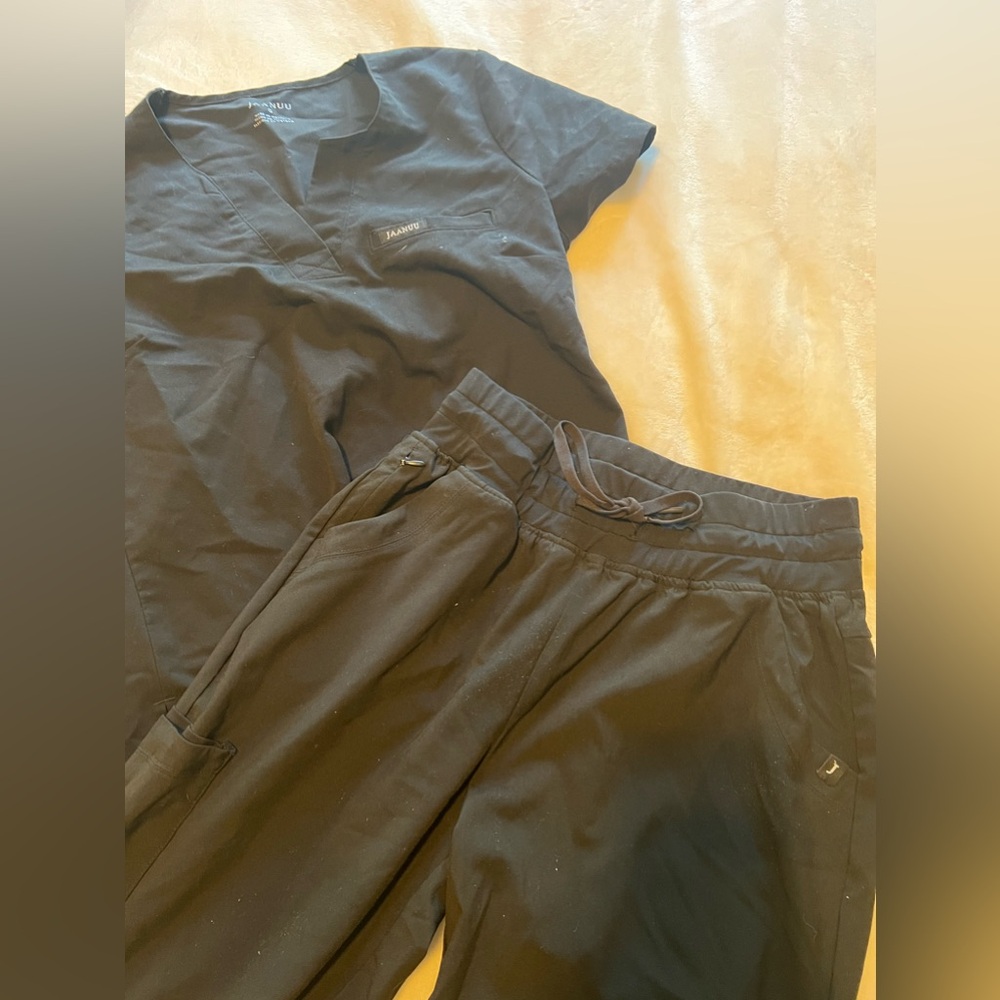 Black Jaanuu tulip pants and tuck in shirt in size small.